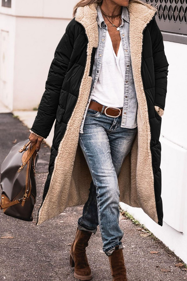 Warme Damen Winter Pufferjacke, reversibel, langer Schnitt für Komfort & Kälteschutz.