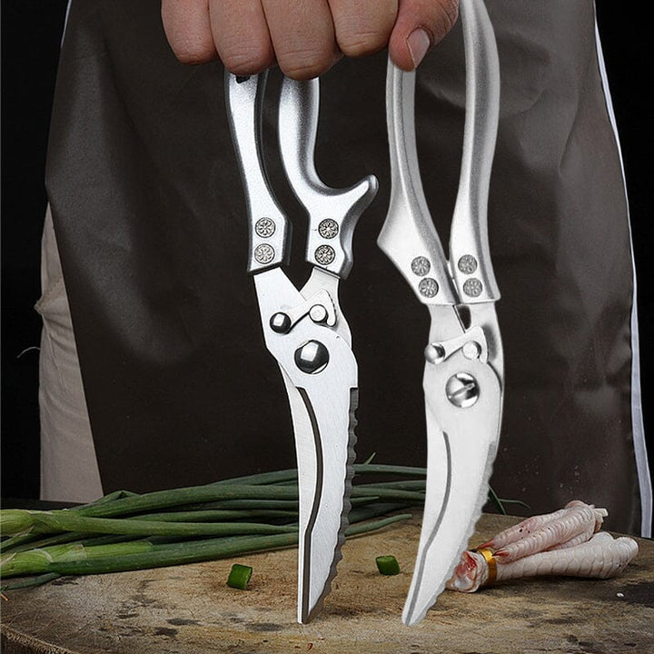 Robuste Fleischschere aus Edelstahl mit ergonomischem Griff. Perfekt für präzises Schneiden.