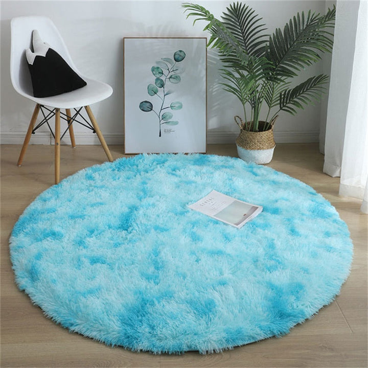 Weicher runder Polyesterteppich, flauschig & pflegeleicht. Ideal für Schlaf- oder Wohnzimmer.