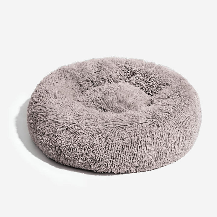 Stylisches, rundes Hundebett für moderne Wohnungen. Flauschiger Schlafplatz, angstlösend & pflegeleicht.