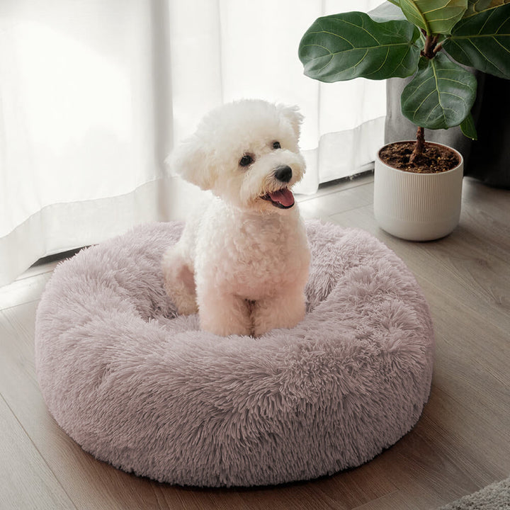 Rundes, dick gepolstertes Hundebett. Flauschiger Komfort & Unterstützung für Gelenke, ideal zum Entspannen.