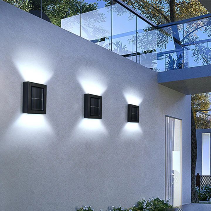 Kompakte Solar-Wandleuchte mit hellen LEDs und markantem Doppel-Schatten-Effekt für jede Wand.