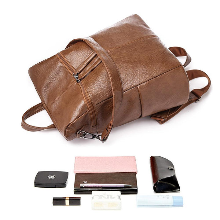 Stilvoller Damen-Lederrucksack in Schwarz, getragen, perfekt für den urbanen Alltag & Business-Look.