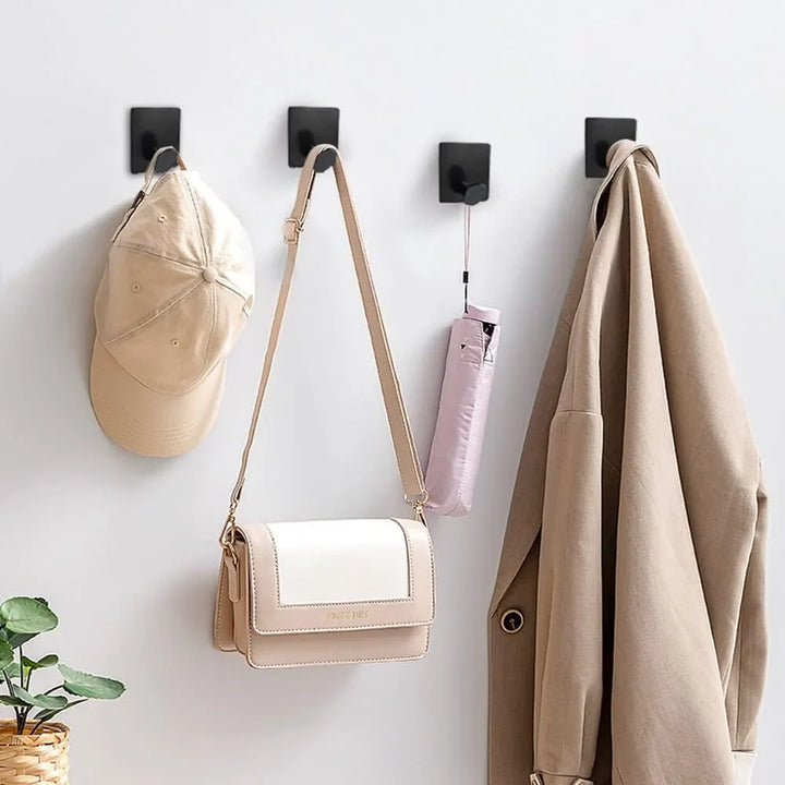 Elegante silberne selbstklebende Edelstahl Wandhaken, bohrerfrei. Modern, langlebig, ideal für Garderobe & Küche.