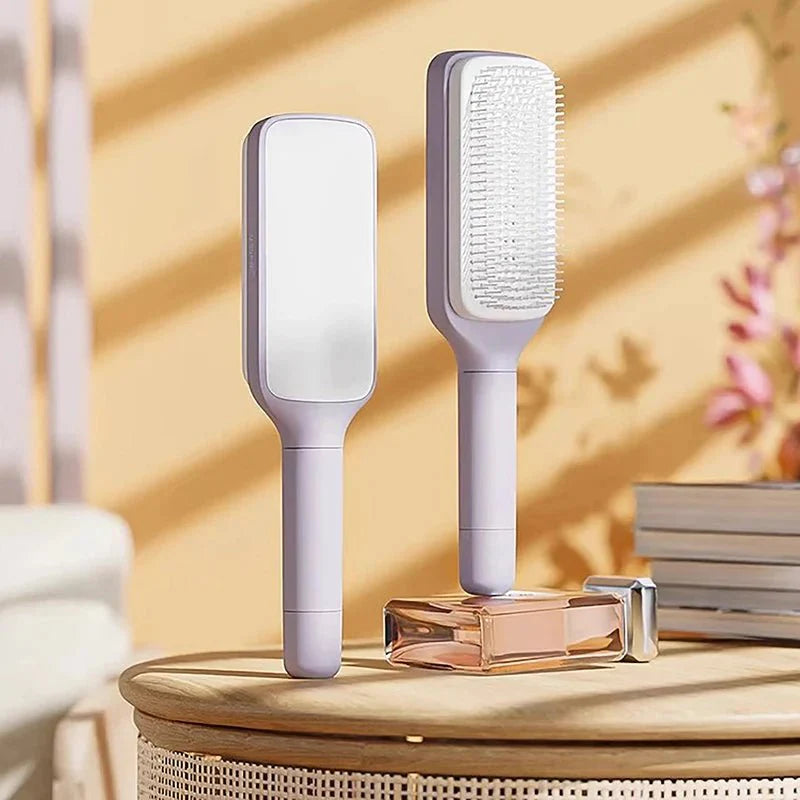 Lila Air-Cushion Entwirrbürste für sanfte Kopfhautmassage und einfache Haarpflege.