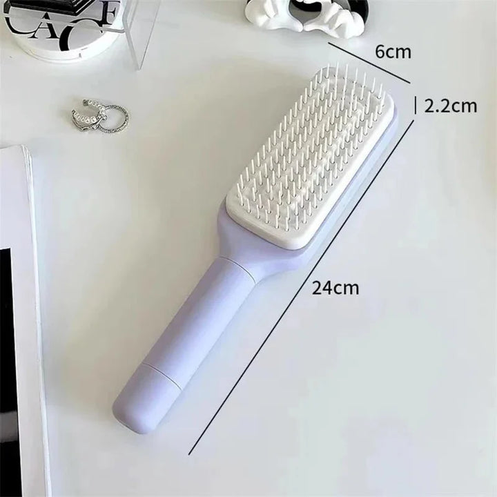 Lila Haarbürste mit Air Cushion Technologie für sanfte Entwirrung und entspannende Kopfhautmassage.