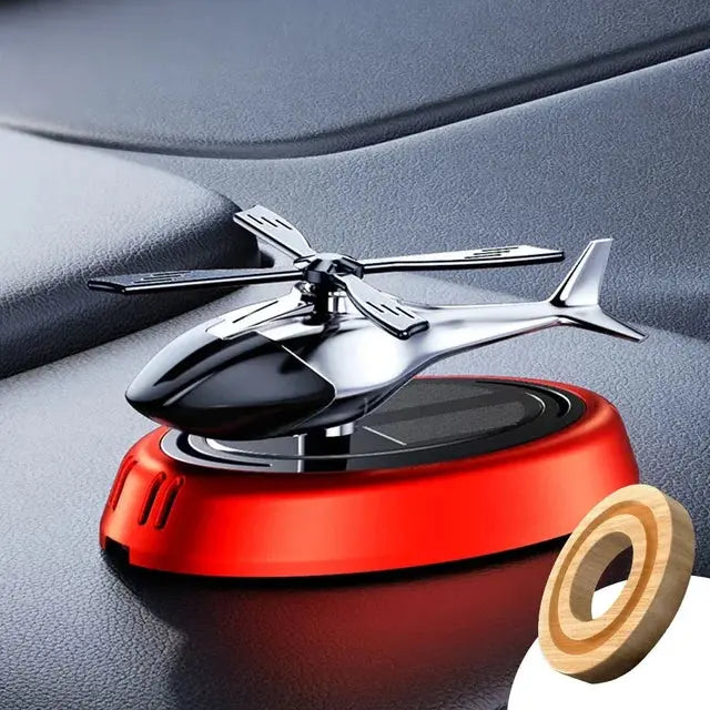 Glänzender Solar-Hubschrauber Lufterfrischer mit rotierenden Rotorblättern. Verleiht dem Auto frischen Duft.