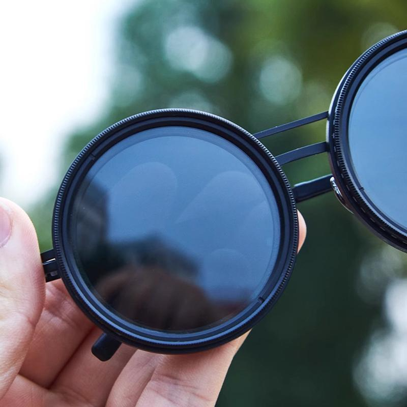 Stilvolle runde Sonnenbrille mit Metall-Vollrahmen & anpassbarer Tönung. Perfekt als Accessoire.