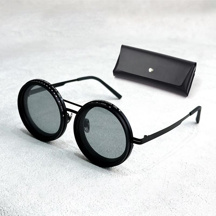 Premium-Sonnenbrille: Anpassbare Tönung, maximaler UV- & Blendschutz. Runder Vollrahmen.