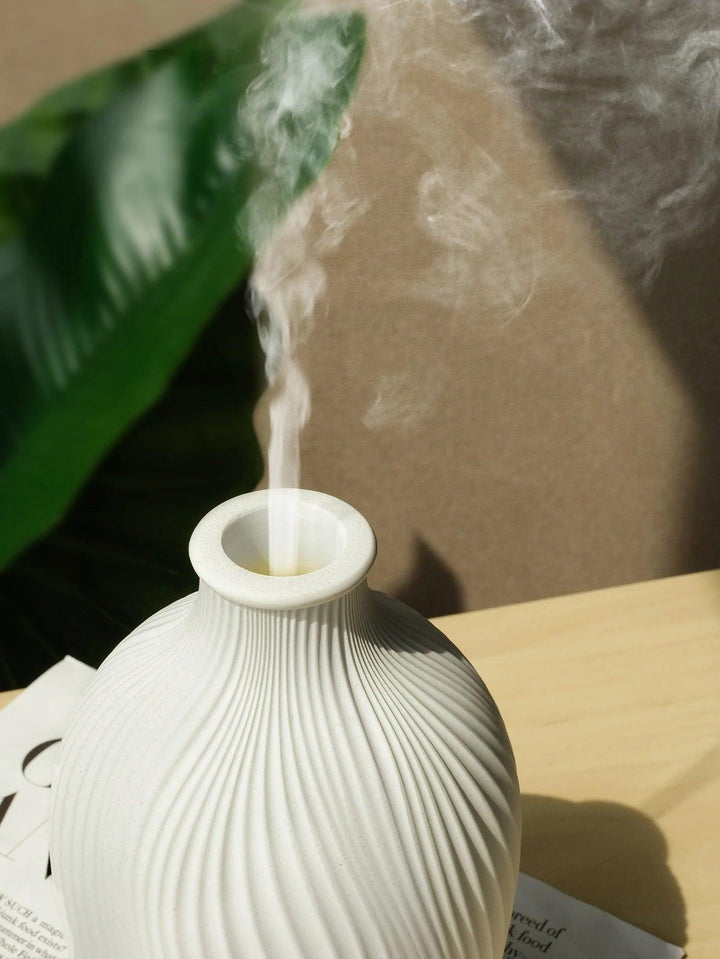 Eleganter Boho Stil Aroma Diffuser aus Polyresin mit LED Beleuchtung, ideal für eine Wohlfühloase.