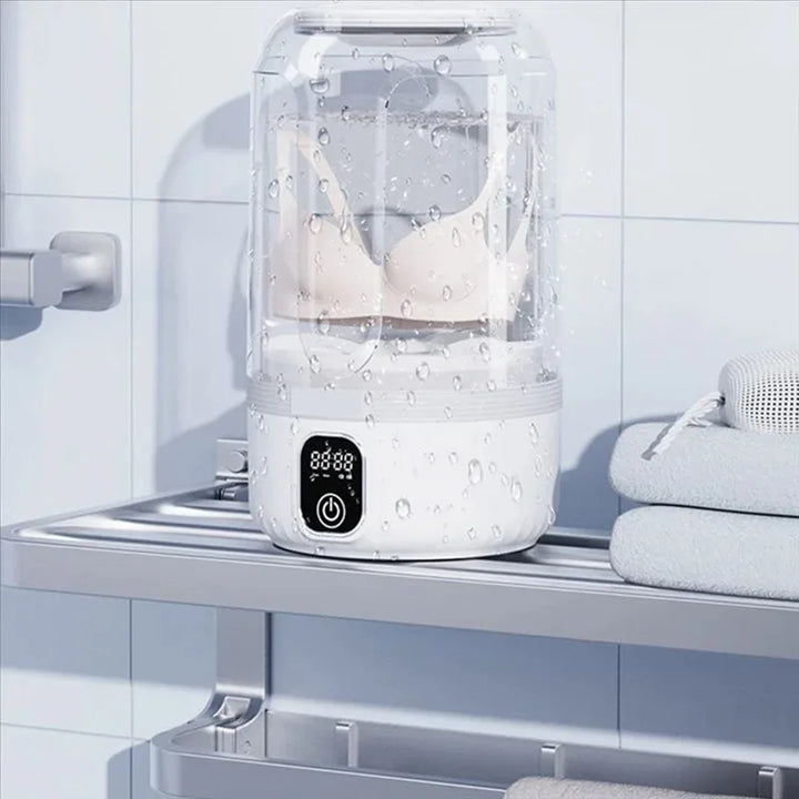 Reise-Waschmaschine mit LED-Display für unterwegs. Reinigt schnell Kleinwäsche im Hotel oder beim Camping.