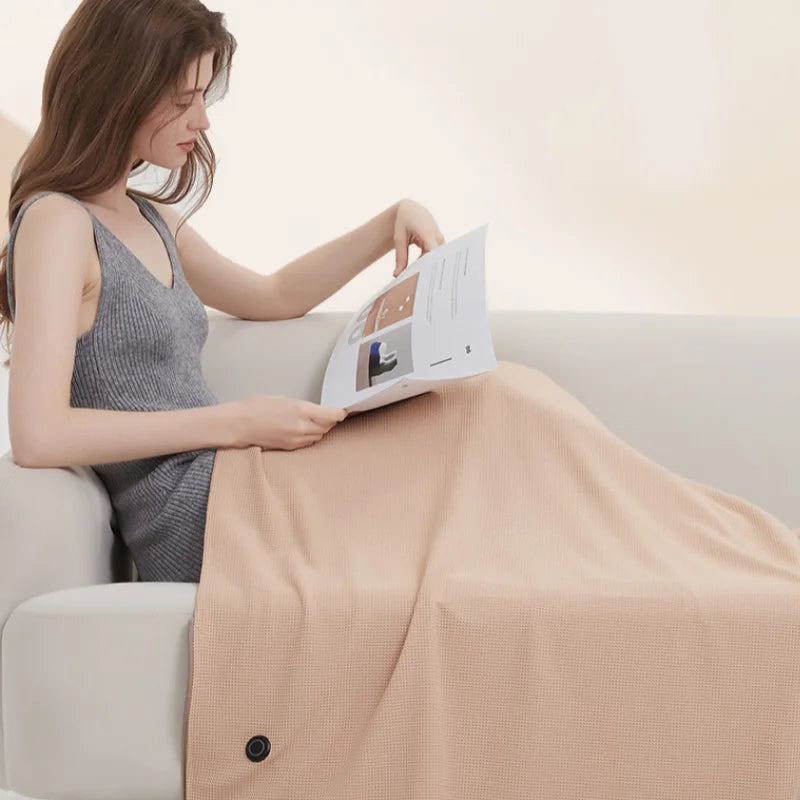 Tragbare USB-Heizdecke in Aprikose, weich, mit 3 Heizstufen, ideal als Kuscheldecke für Büro & Reise.