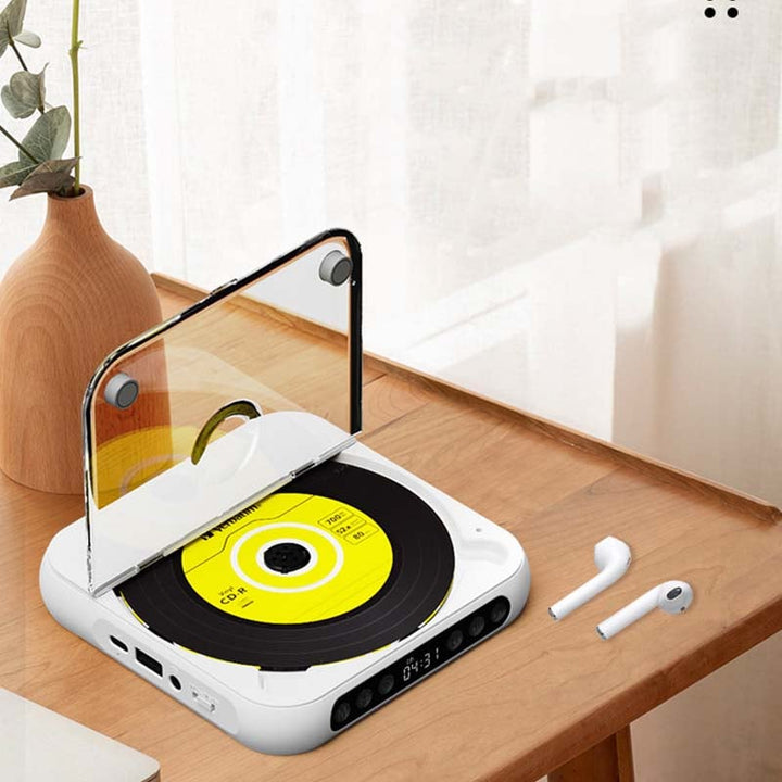 Genieße Musik mit diesem tragbaren CD-Player mit Bluetooth; verbinde ihn mit externen Lautsprechern.