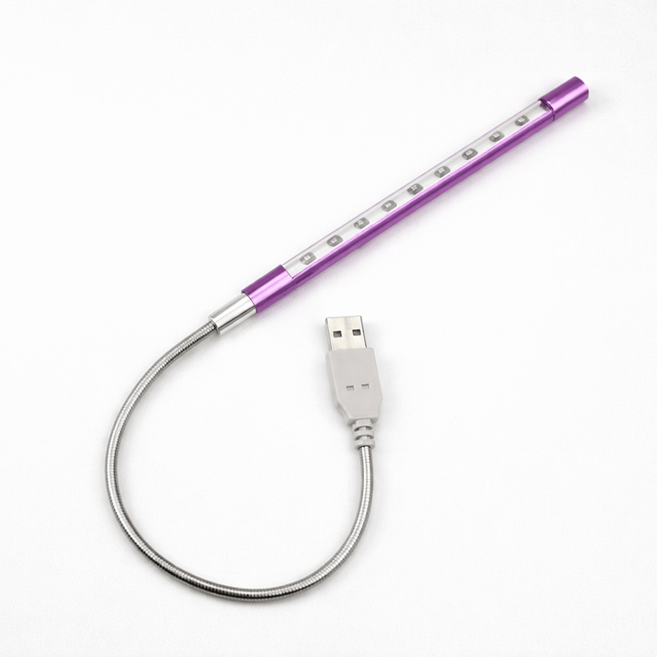 Lila LED-Tastaturlicht, tragbar, stilvolles Computerzubehör für entspanntes Arbeiten.
