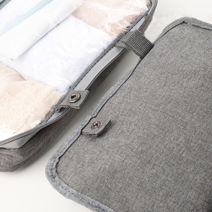 Travelique Kulturtasche, pfirsichhaut-Optik, wasserabweisend, unisex, mit Haken für Badezimmer.