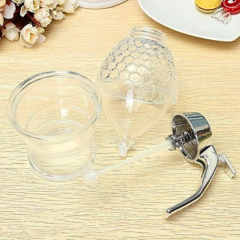 Praktischer Honigspender, transparentes Design, elegant auf jedem Tisch. Sauberes Servieren.
