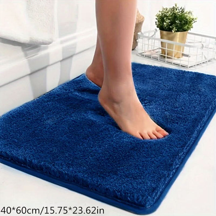Badematte, pflegeleicht & waschbar, hält das Badezimmer sauber und trocken.