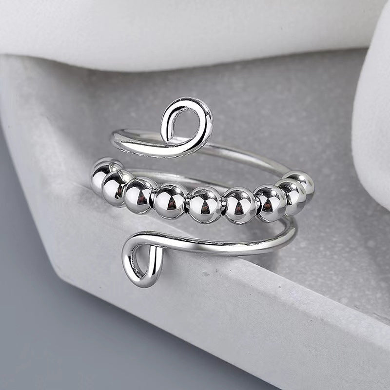 Stilvoller Kupferring mit beweglichen Drehperlen; unisex Fidget-Schmuck für Entspannung.