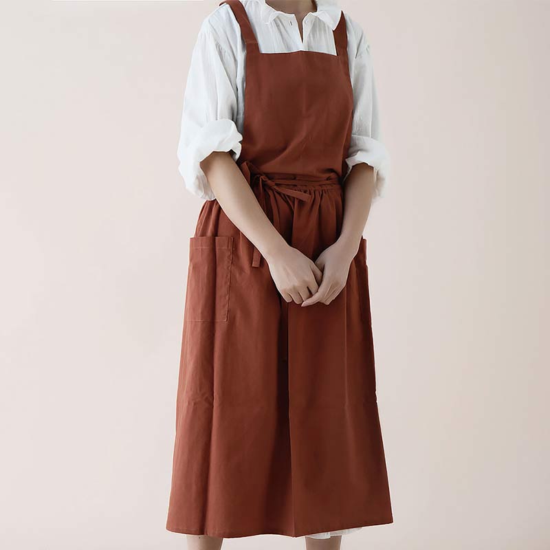 Praktische Unisex Schürze aus 100% Baumwolle, mit Kreuzgurt und vielen nützlichen Taschen.