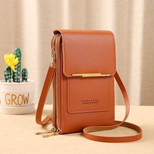 Schwarze Crossbody Handytasche mit verstellbarem Riemen, sicherer Reisebegleiter & Alltags-Accessoire.