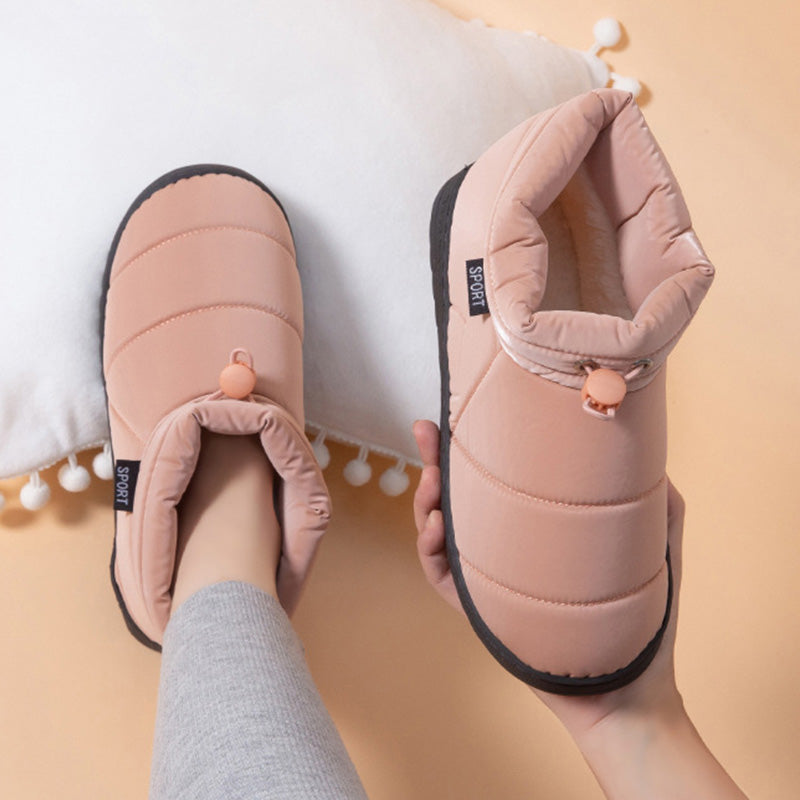 Stilvolle, warme Plüschschuhe unisex. Elektrisch beheizt für gemütliche Stunden. Erhältlich in Rosa, Grau, Schwarz.