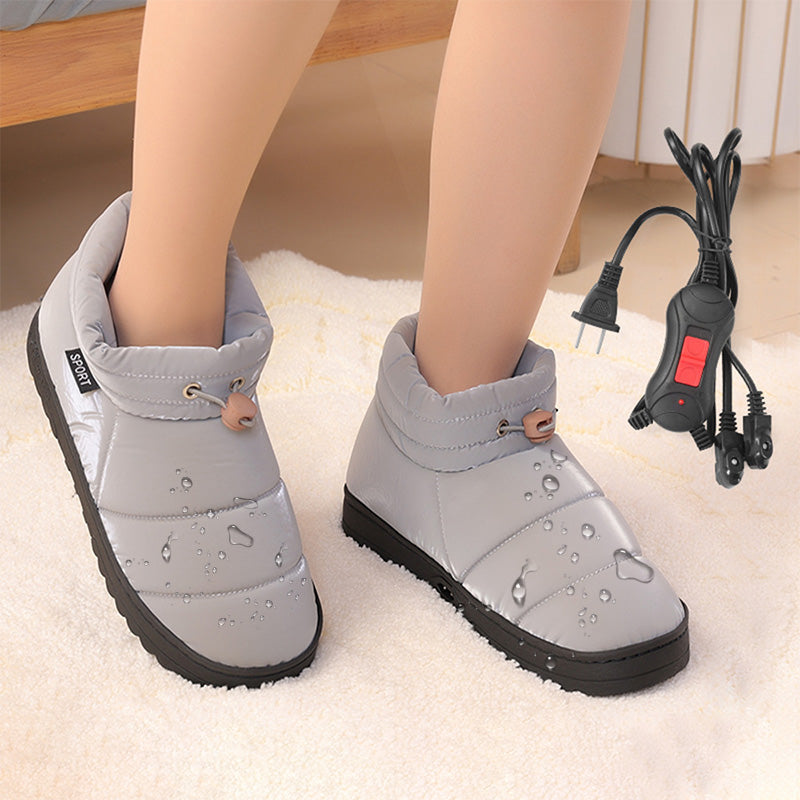 Graue, unisex beheizte Plüschschuhe. Kuschelige Winterschuhe mit Elektrowärme für wohltuenden Fußkomfort.