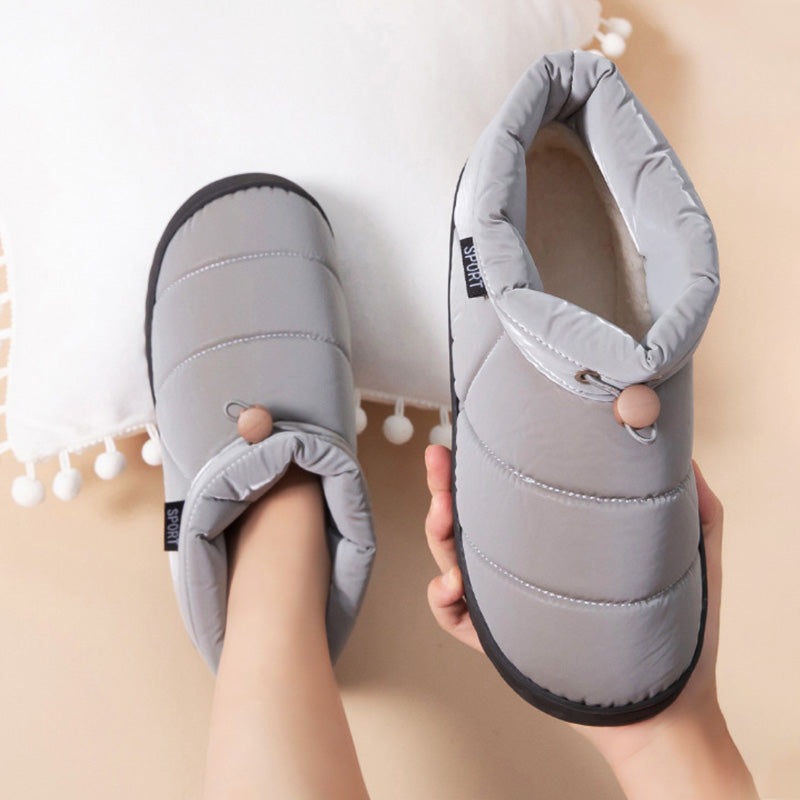 Innovative elektrisch beheizte Plüschschuhe, unisex. Bieten konstante Wärme & Entspannung für die Füße.