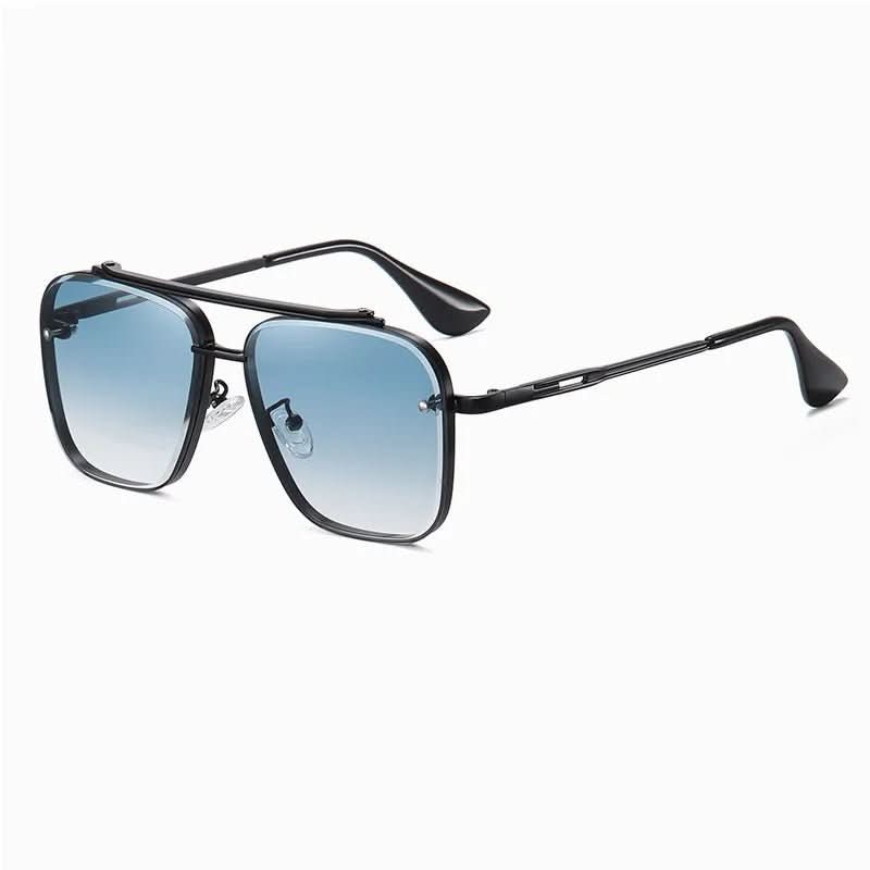 Farbverlaufsgläser einer stilvollen Unisex Sonnenbrille, umgeben von einem feinen Metallrahmen.