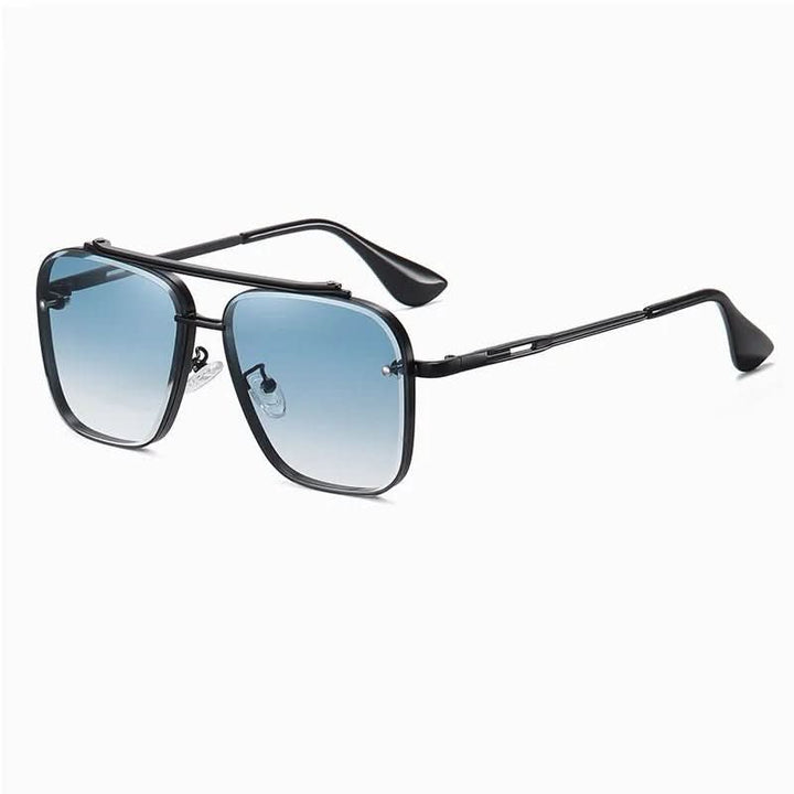 Farbverlaufsgläser einer stilvollen Unisex Sonnenbrille, umgeben von einem feinen Metallrahmen.