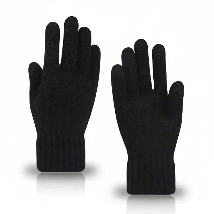 Person bedient Smartphone mit warmen Touchscreen-Handschuhen, keine kalten Finger mehr dank Kälteschutz im Winter.