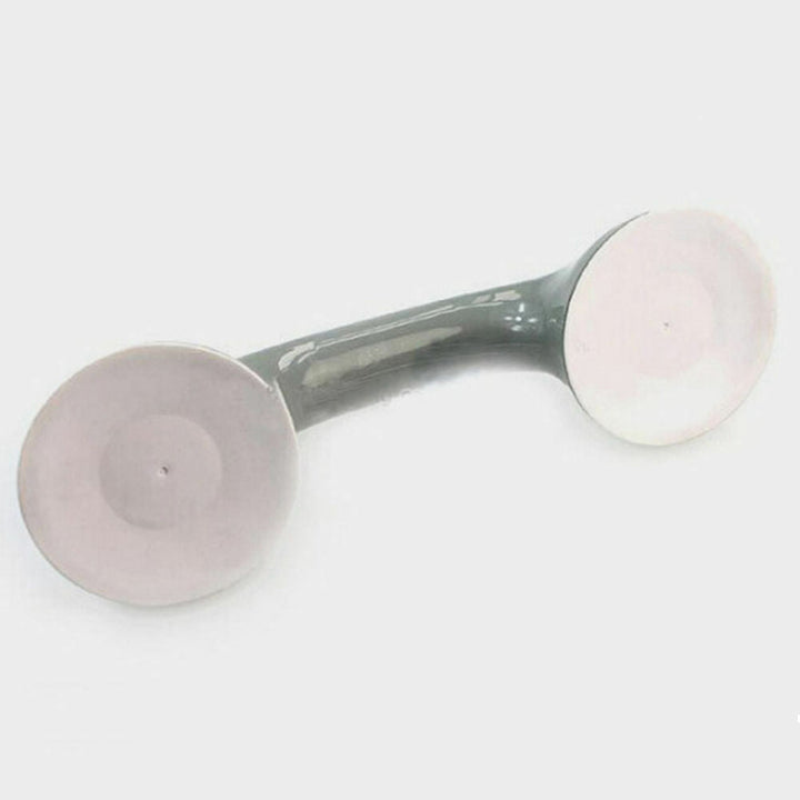 Ergonomischer Bad-Haltegriff, weiß, mit zwei großen Saugnäpfen für schnellen, sicheren Halt an glatten Flächen.
