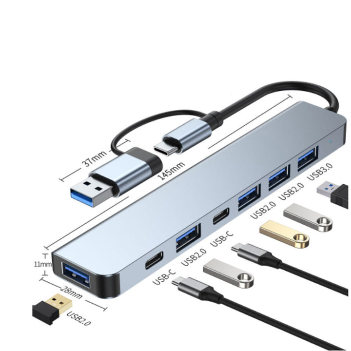 MacBook Zubehör: USB-C Hub mit HDMI-Ausgang, USB-A Anschlüssen und SD-Kartenleser.