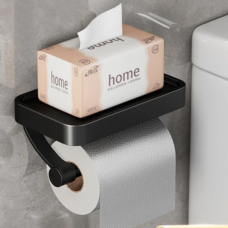 Robuster Toilettenpapierhalter in Edelstahl-Optik, wandmontiert mit extra Ablagefläche.