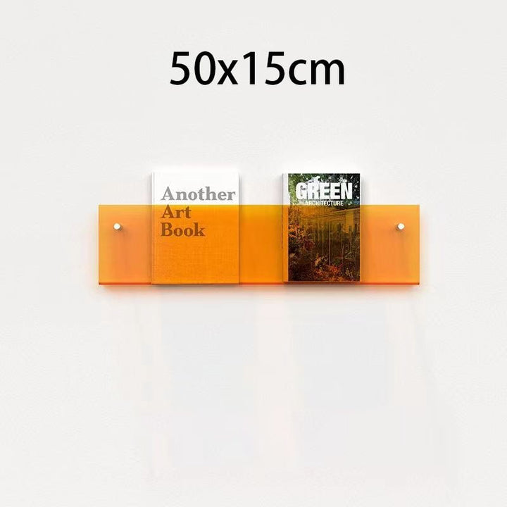 Acryl-Halter für Magazine mit schwebender Optik, ideal für die moderne Wohnzimmergestaltung.