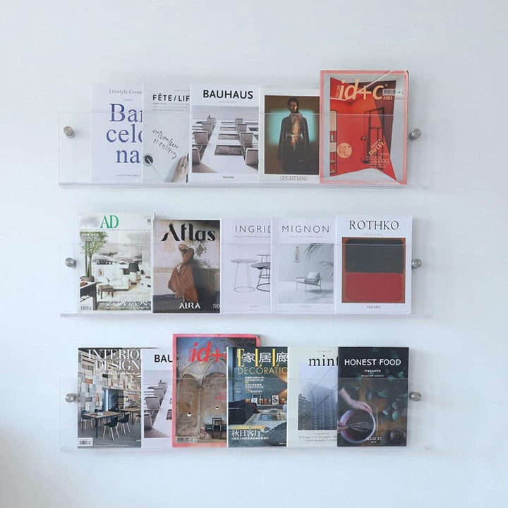 Minimalistisches Acryl Zeitschriftenregal, wandmontiert. Schafft Ordnung mit schwebendem Design. Orange-transparent.