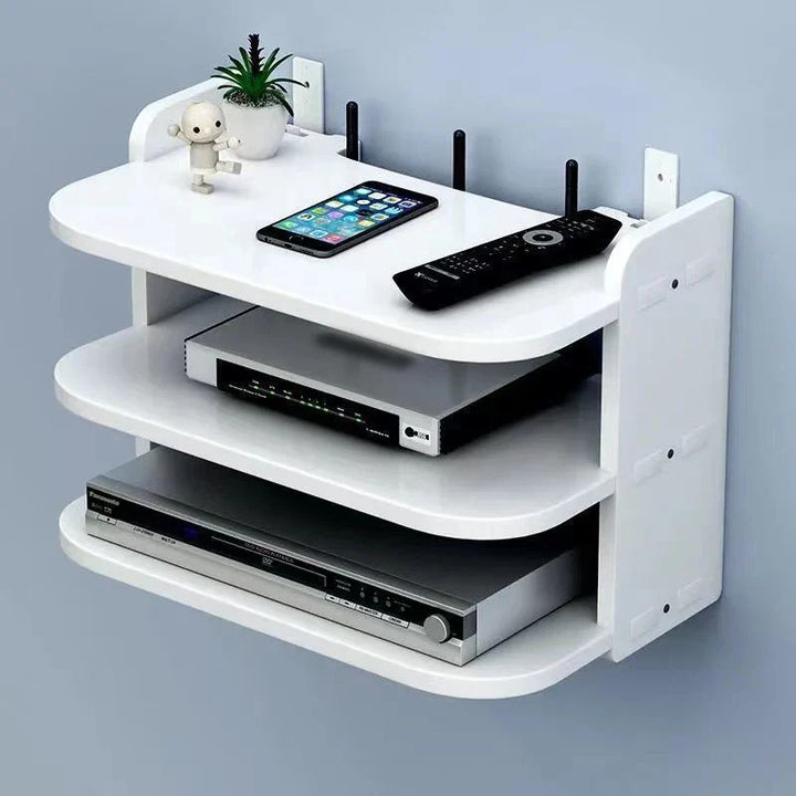 Weißes, schwebendes Wandregal mit Kabelmanagement für WLAN-Router und TV-Boxen.