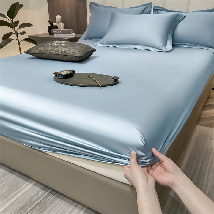 Graues Spannbettlaken aus reiner Baumwolle, atmungsaktiv und weich für besten Schlafkomfort im Schlafzimmer.
