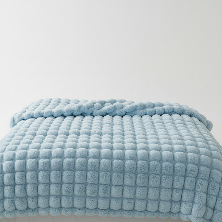 Warme und dekorative Plüschdecke, ein Must-have für ein gemütliches Zuhause.
