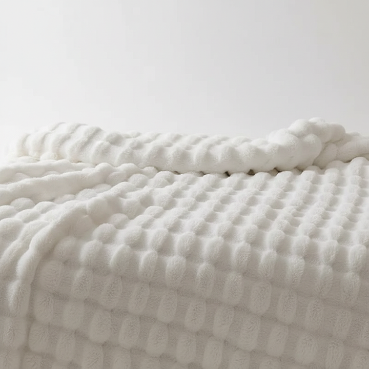 Luxuriöse Kuscheldecke für dein Wohnzimmer, extra flauschig und wärmend.