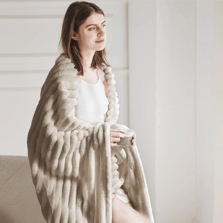 Warme Fleece-Kuscheldecke, perfekt für gemütliche Stunden und tiefe Entspannung.
