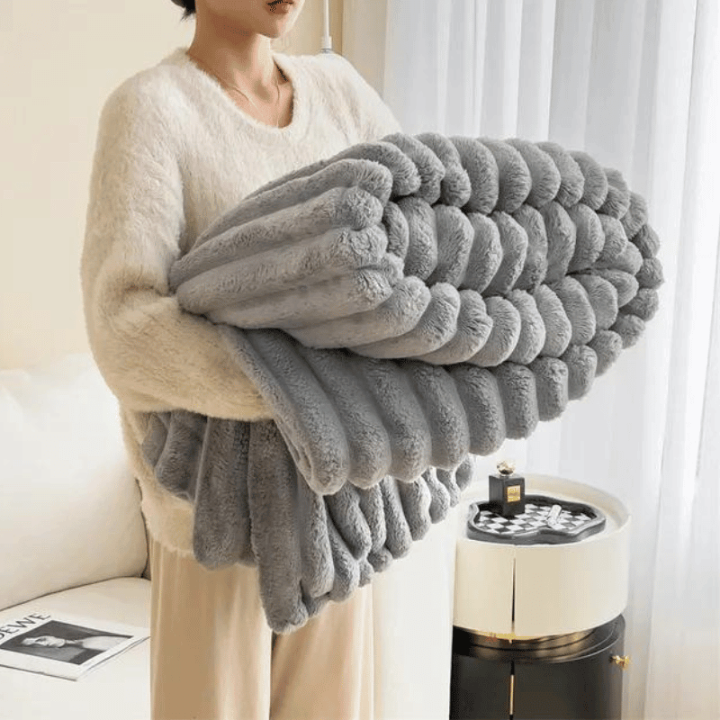 Pflegeleichte und warme Fleecedecke, die zum Wohlfühlen einlädt.