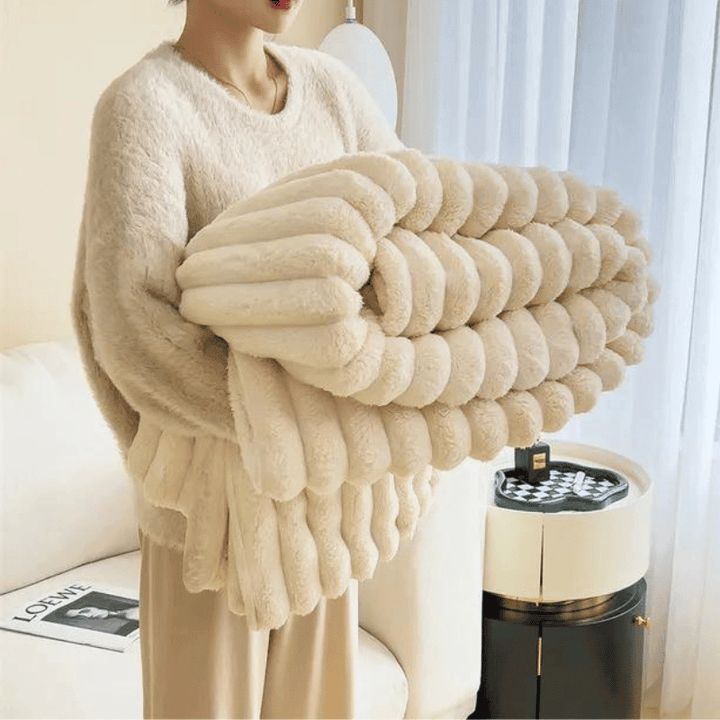 Gemütliche Decke für Sofa und Bett, flauschig und wärmend.